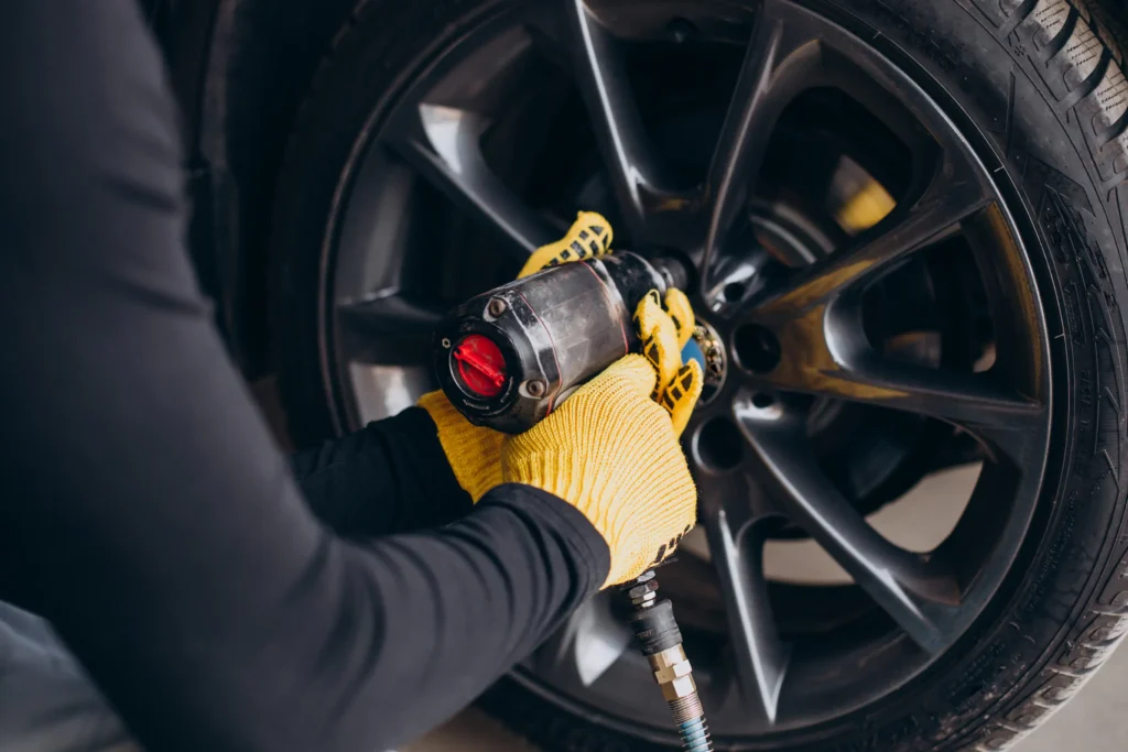 car-mechanic-changing-wheels-car-opt