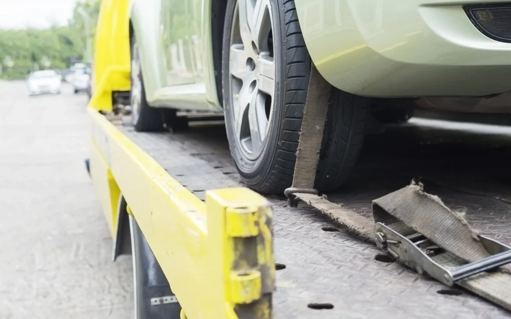 car-transporter-breakdown-lorry-working-using-locked-belt-transport-other-green-car-opt